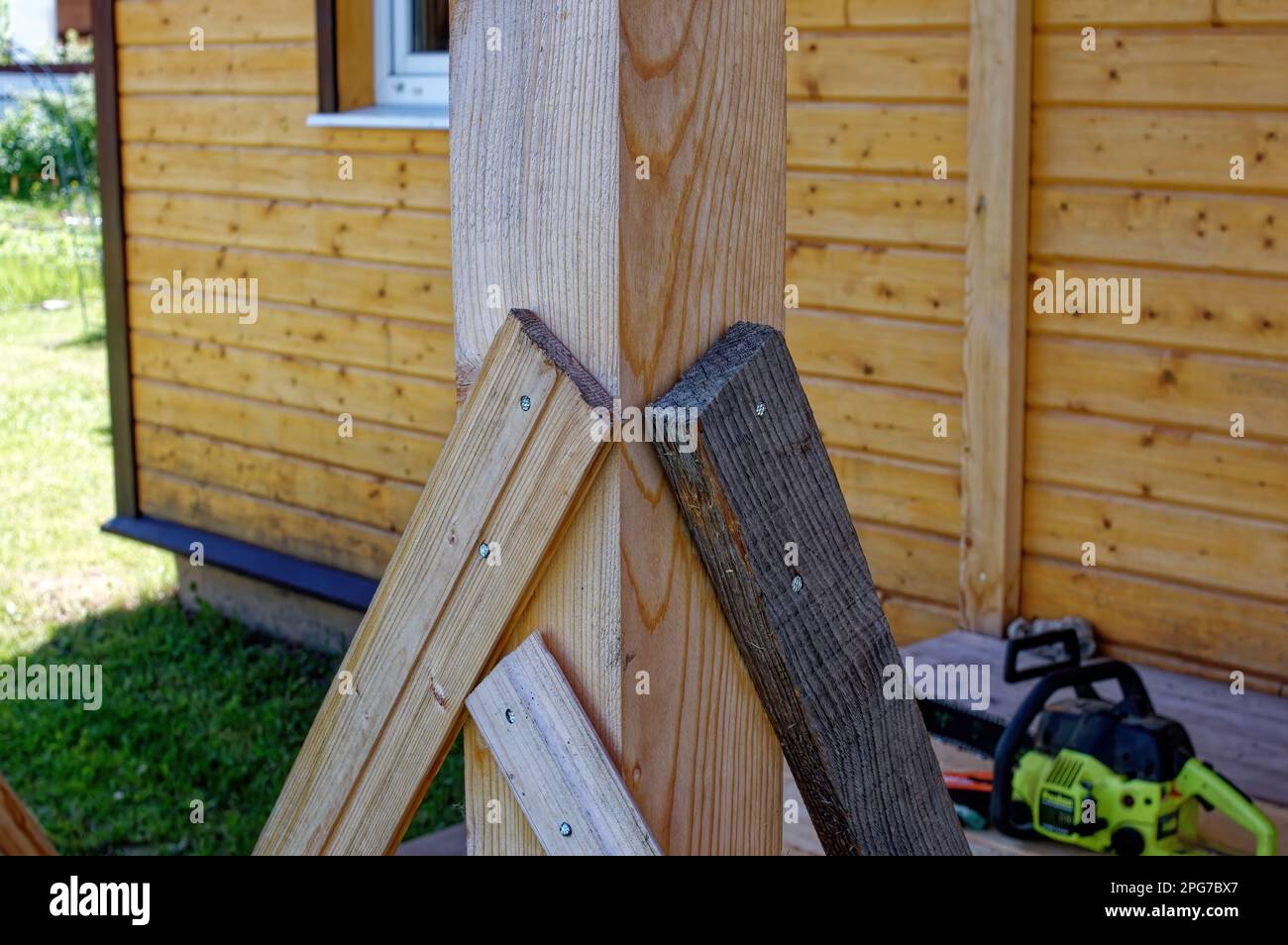 construction of wooden extensions of a rural house, russia Stock Photo