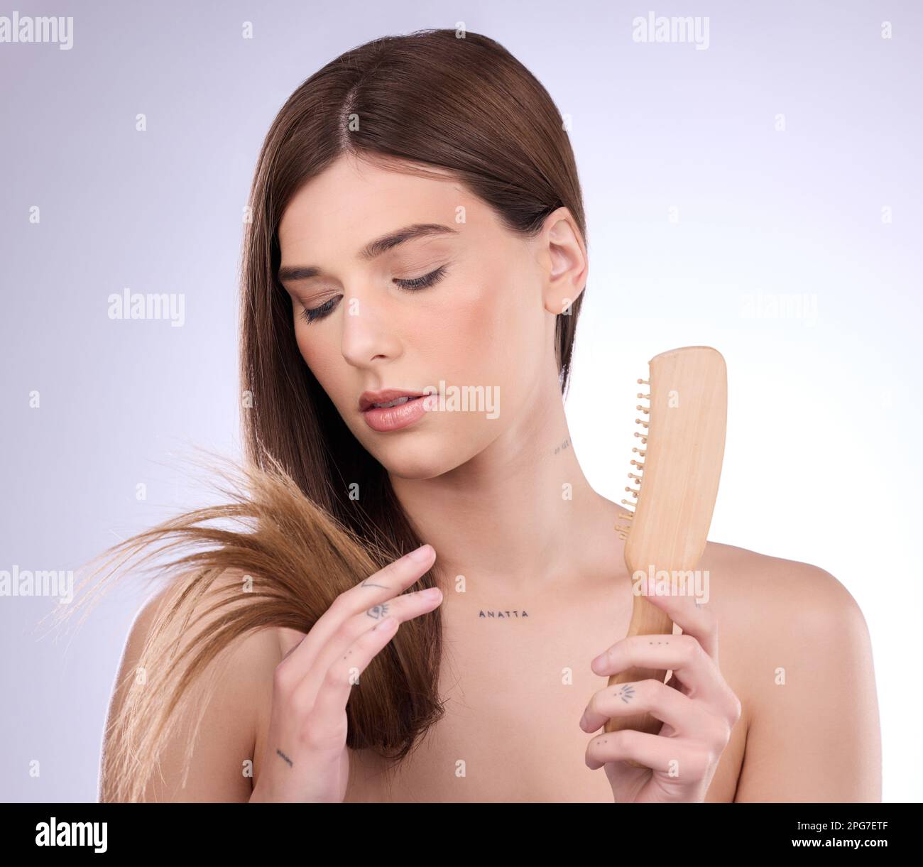 Split ends, hair and woman holding a brush in a isolated, white