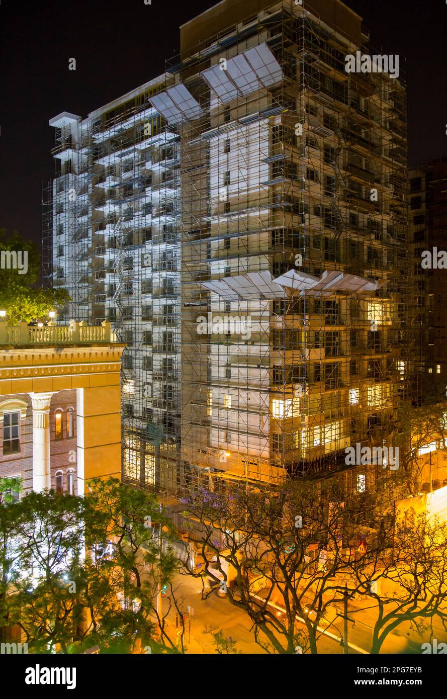 Nigh time view of a new highrise apartment building during construction in the Rosebank CBD