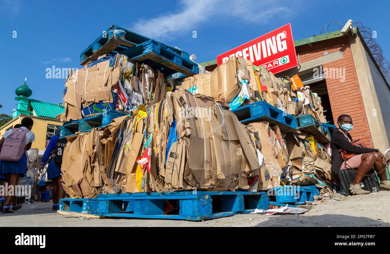 Used cardboard boxes flattened and bundled for disposal or recycling