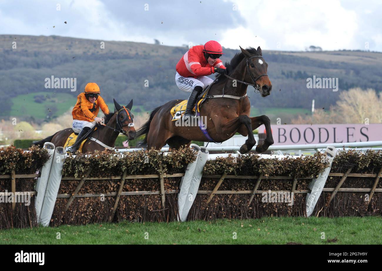 First race 1.30 The JCB Triumph Hurdle.   Cinsa ridden by Brian Hayes jumps the last ahead ofJacovec Cavern ridden by Sean Flanagan    Horse racing at Stock Photo