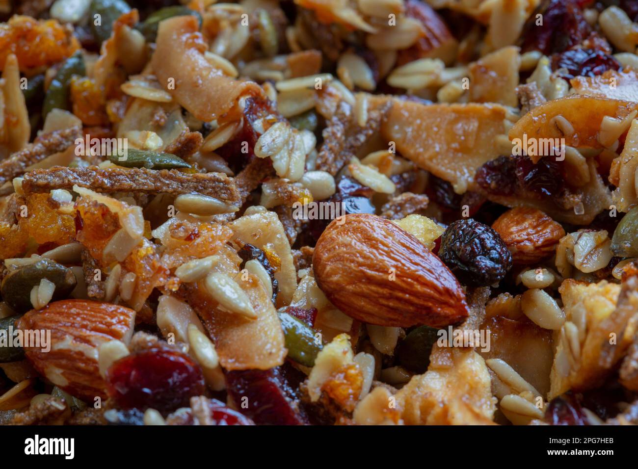 Healthy breakfast cereal mix including almonds, rolled oats, sunflower