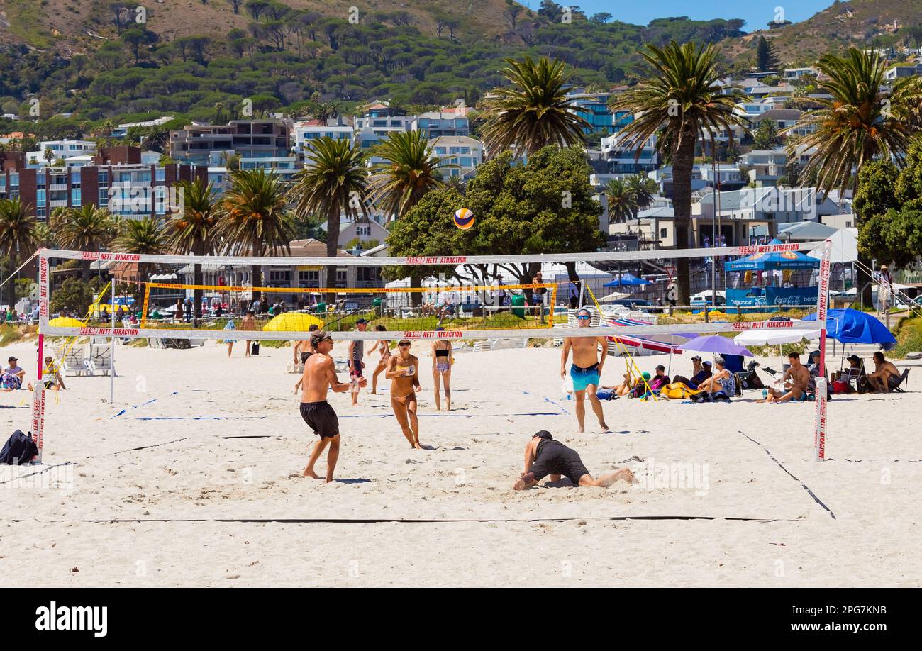Cape Town, South Africa - February 19, 2023: Young people playing beach volleyball Stock Photo