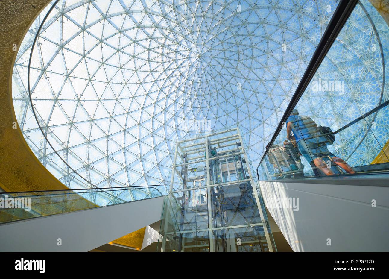 View up from the underground shopping mall at one of the glass dome entrances to the complex. At