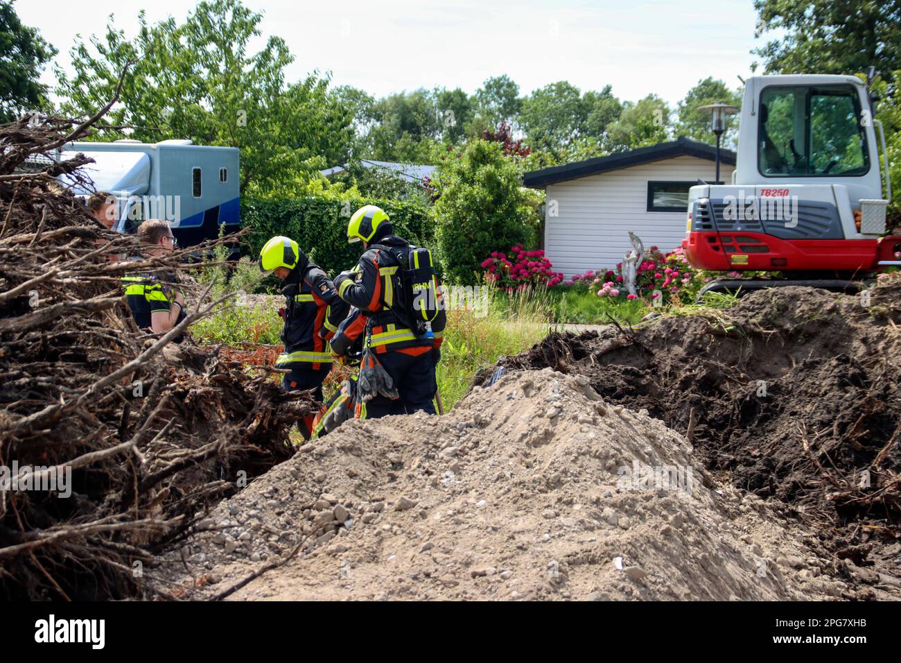 Firefighters must take action if a gas pipe is hit during excavation work at Park de IJsselhoeve in Nieuwerkerk aan den IJssel the Netherlands Stock Photo