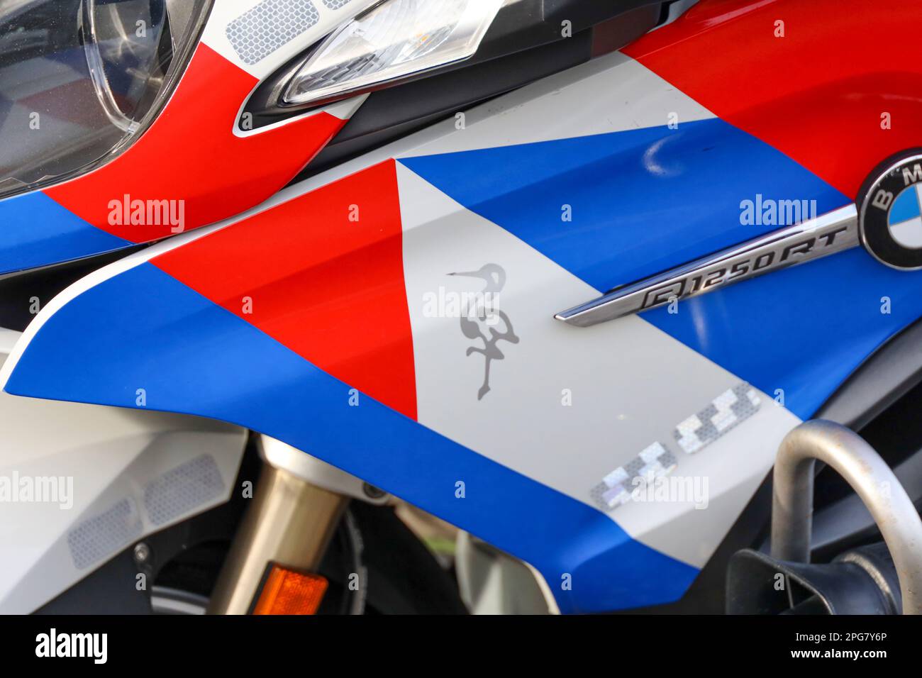 Stork on police motorbike as crest off The Hague at accident site Stock