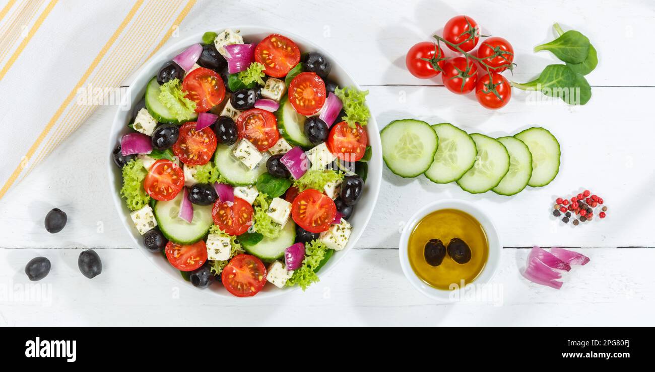 Stuttgart, Germany - December 27, 2022: Greek Salad With Fresh Tomatoes Olives And Feta Cheese Healthy Food Eating Banner From Top On Wooden Board In Stock Photo