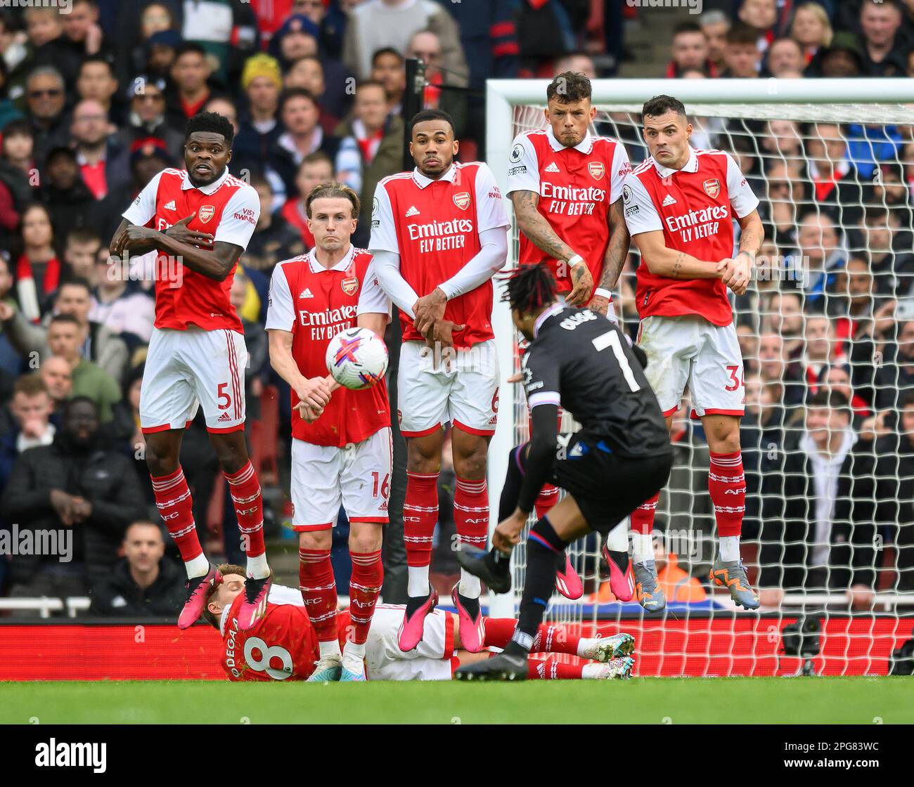 London, UK. 19th Mar, 2023. 19 Mar 2023 - Arsenal v Crystal Palace - Premier League - Emirates Stadium Crystal Palace's Michael Olise fires in a free kick defended by Granit Xhaka, Thomas Partey, Ben White, Gabriel Magalhaes and Rob Holding. Picture Credit: Mark Pain/Alamy Live News Stock Photo