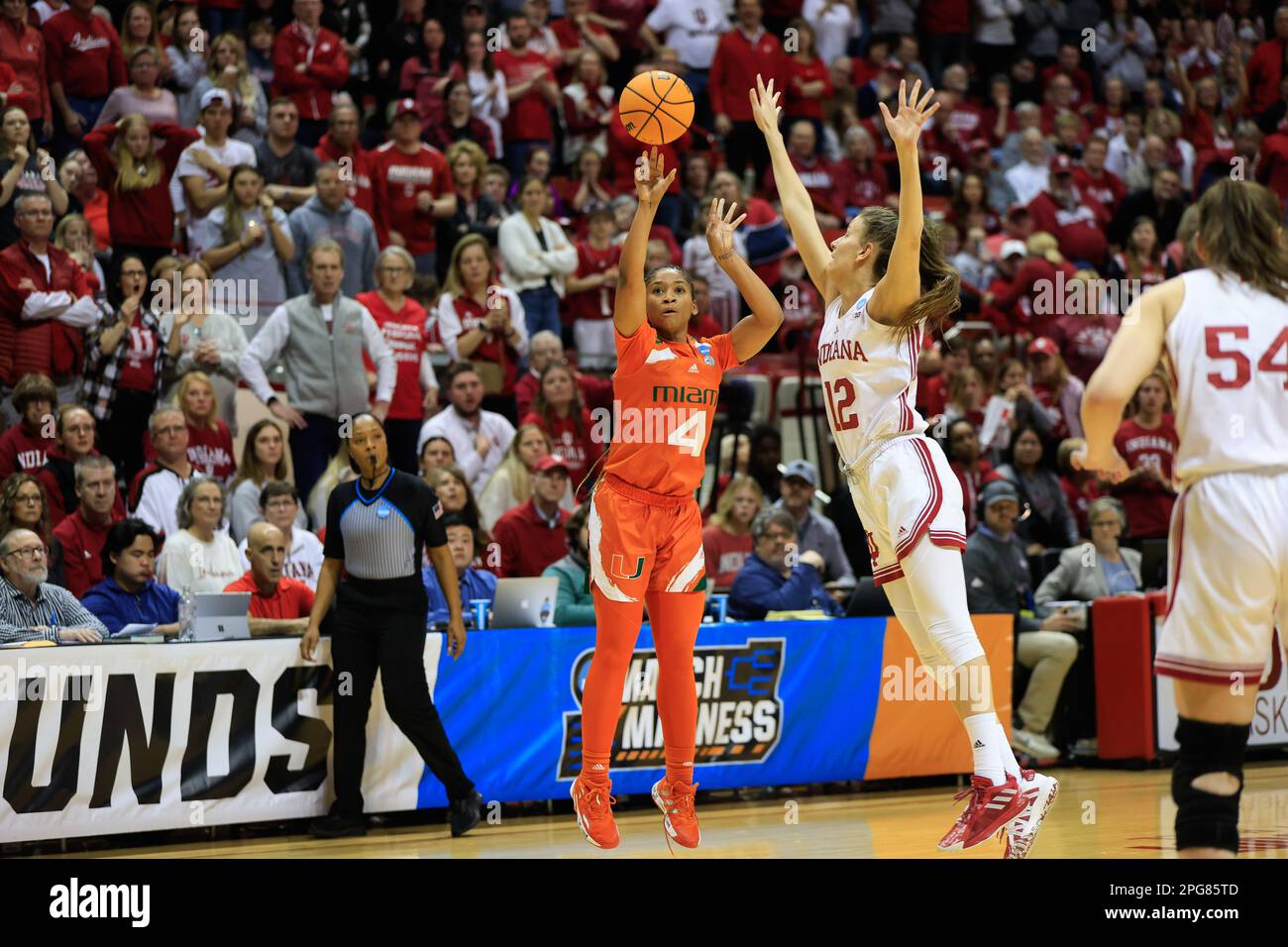 Bloomington, United States. 21st Mar, 2023. Miami Hurricanes guard Jasmyne Roberts (4) shoots against Indiana Hoosiers guard Yarden Garzon (12) during the second round NCAA womenís basketball tournament game at Simon Skjodt Assembly Hall. The Hoosiers lost to the Hurricanes 70-68. (Photo by Jeremy Hogan/SOPA Images/Sipa USA) Credit: Sipa USA/Alamy Live News Stock Photo