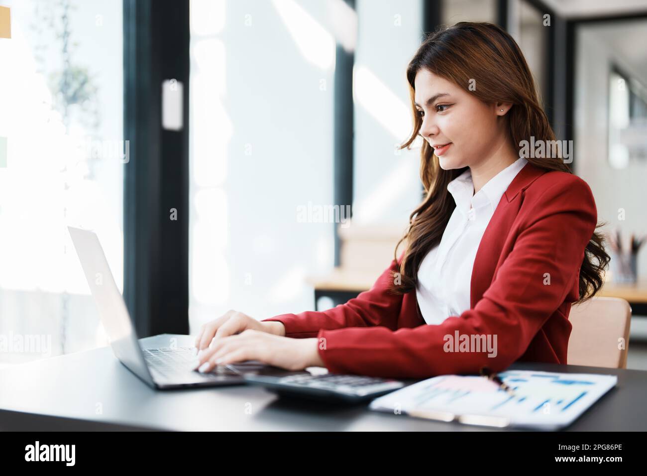Beautiful young teen asian businesswoman using computer laptop and ...