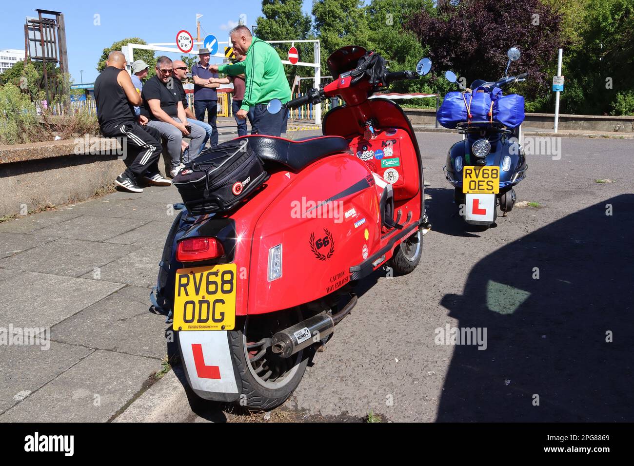 A Royal Alloy and a Lexmoto Milano, a pair of retro styled automatic motor scooters take their styling cues from a Lambretta and Vespa GS respectively. Stock Photo