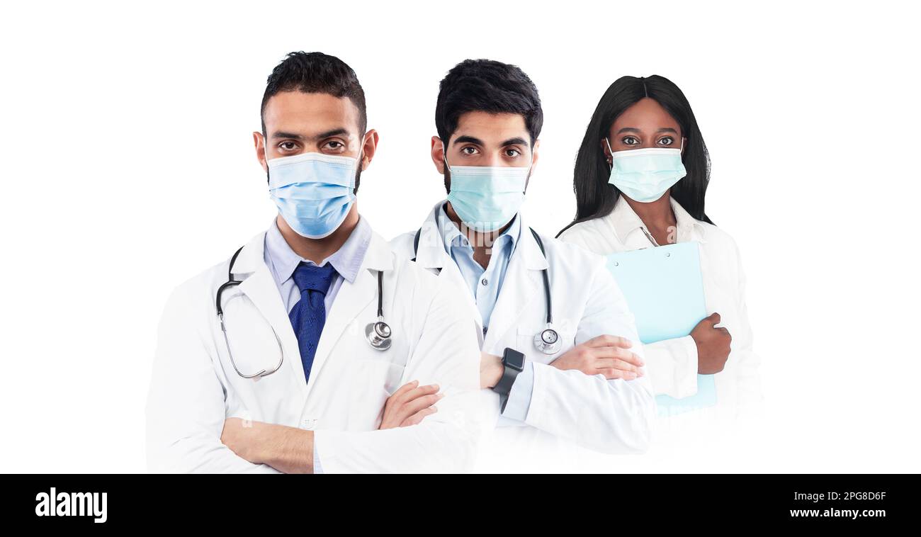 Doctors In Uniform Group of professional doctors in uniform standing isolated over white ...