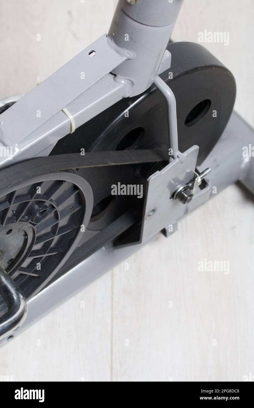 Elements of an exercise bike. Servicing the drive pulley and flywheel