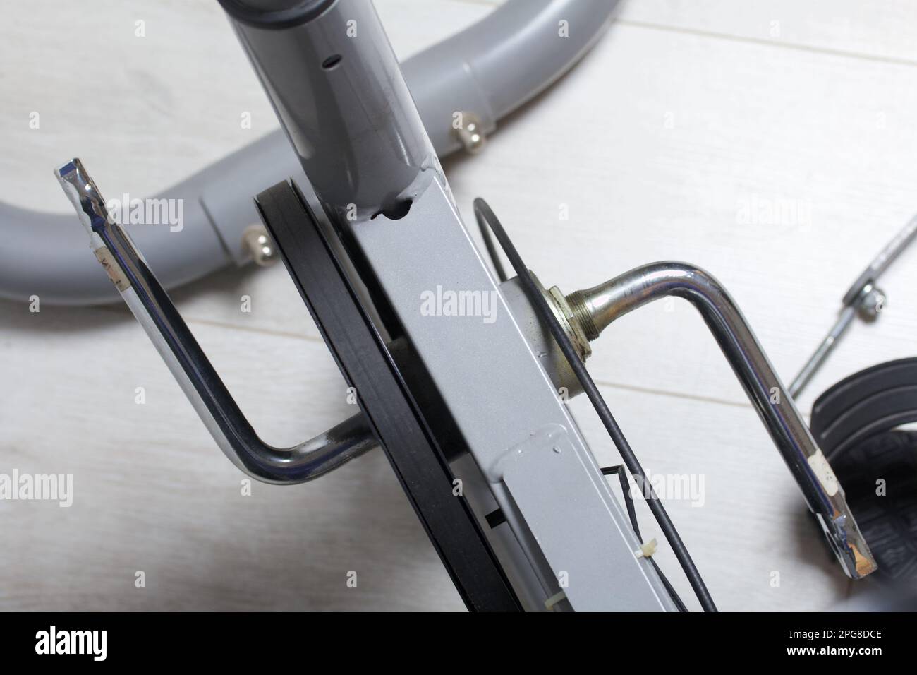 Elements of an exercise bike. Servicing the drive pulley and flywheel