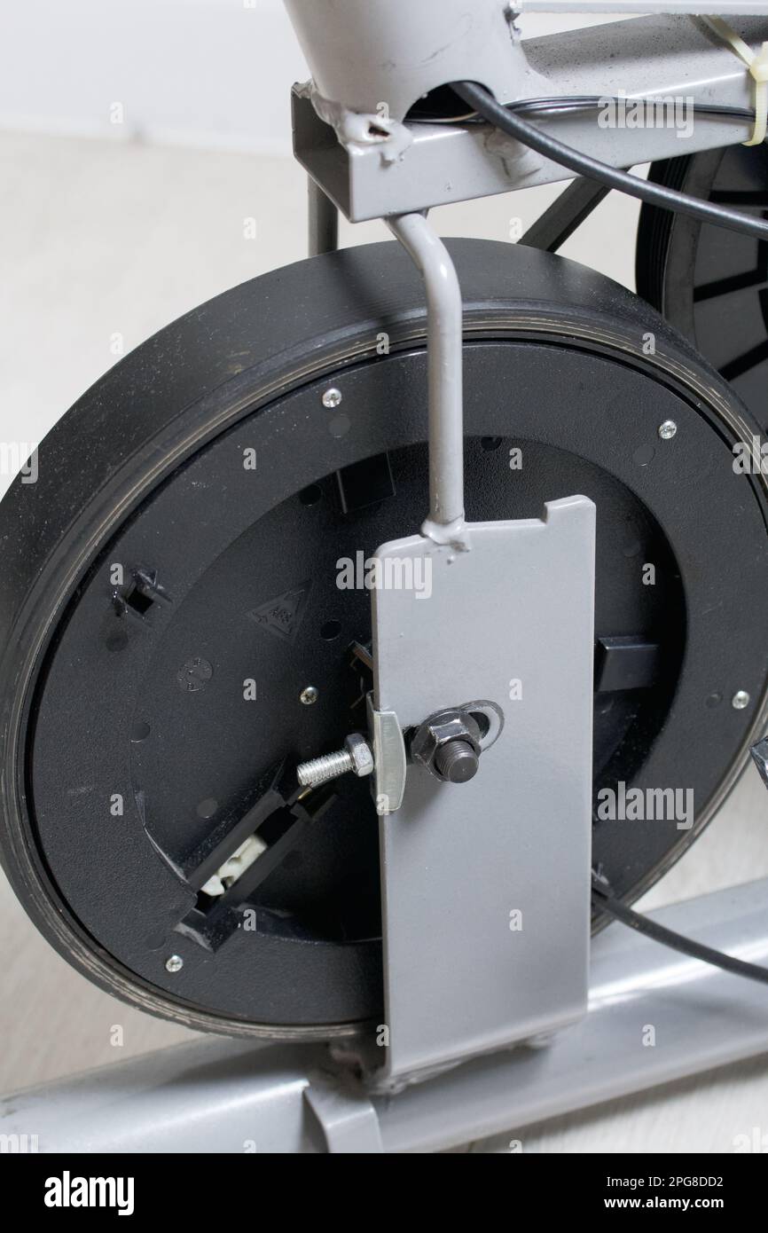 Elements of an exercise bike. Servicing the drive pulley and flywheel