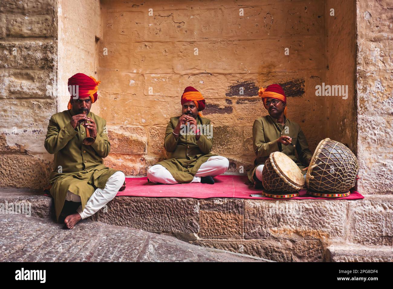 Musicians playing and singing traditional Rajasthani songs and music in Mehrangarh fort, Rajasthan, India Stock Photo