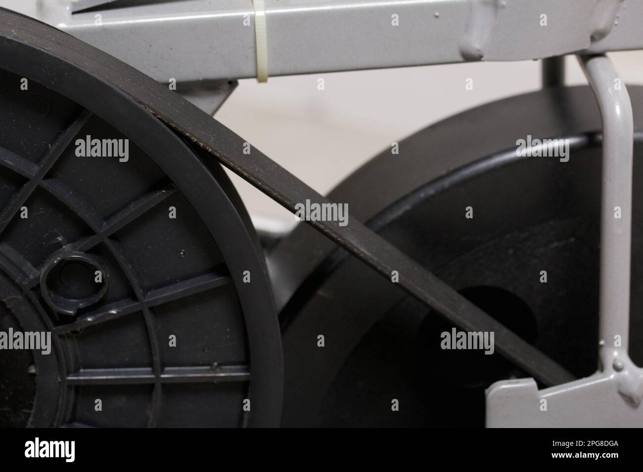Elements of an exercise bike. Servicing the drive pulley and flywheel