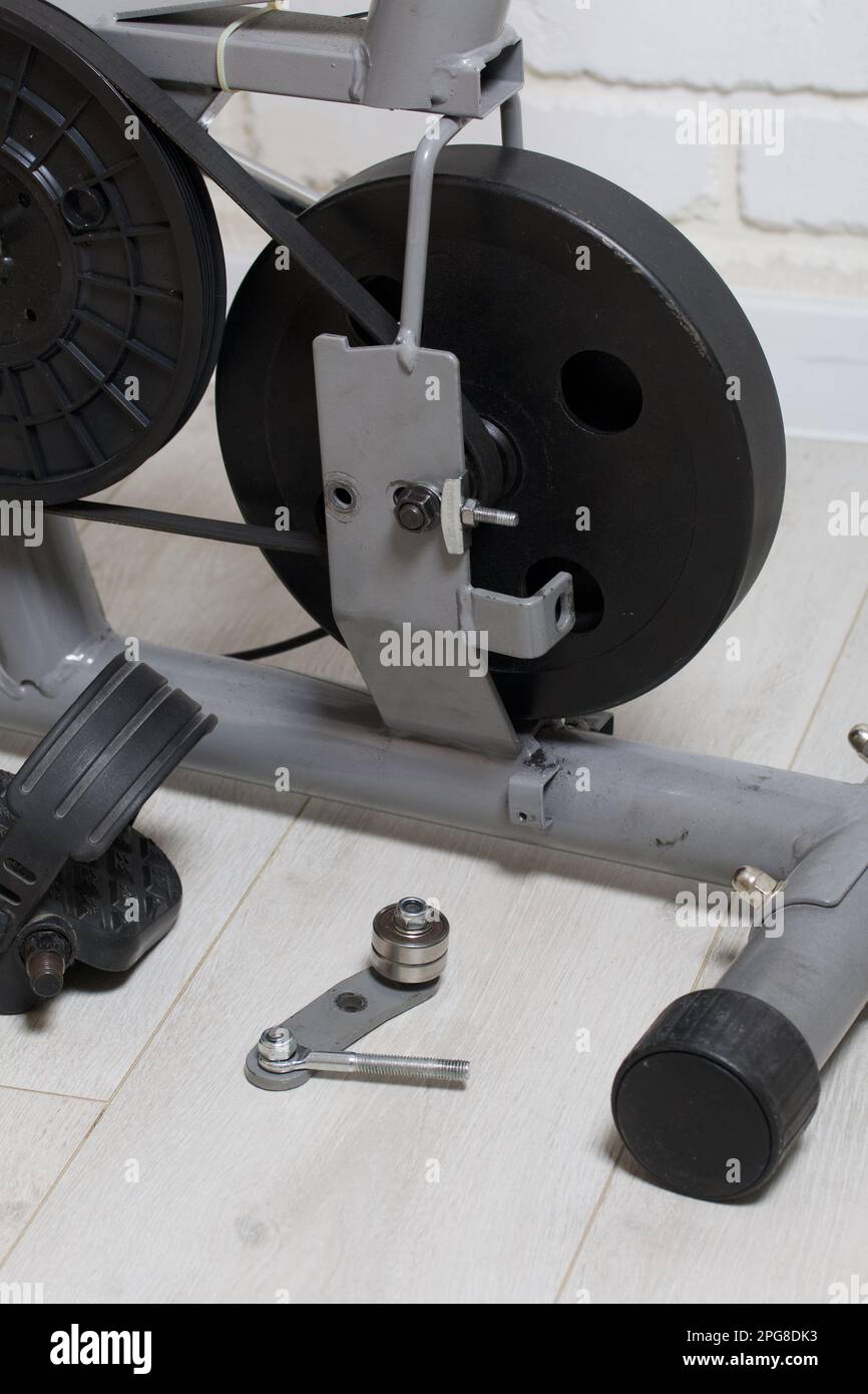 Elements of an exercise bike. Servicing the drive pulley and flywheel