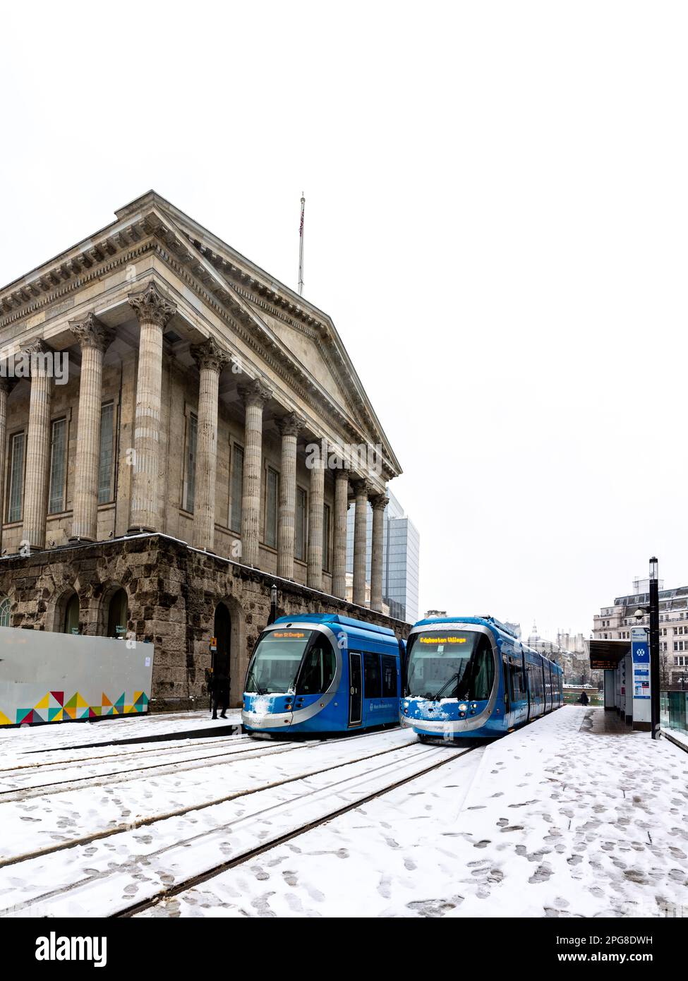 BIRMINGHAM, UK - MARCH 9, 2023.  West Midlands Trams at Birmingham Town Hall building during Winter with heavy snow on the ground disrupting traffic Stock Photo
