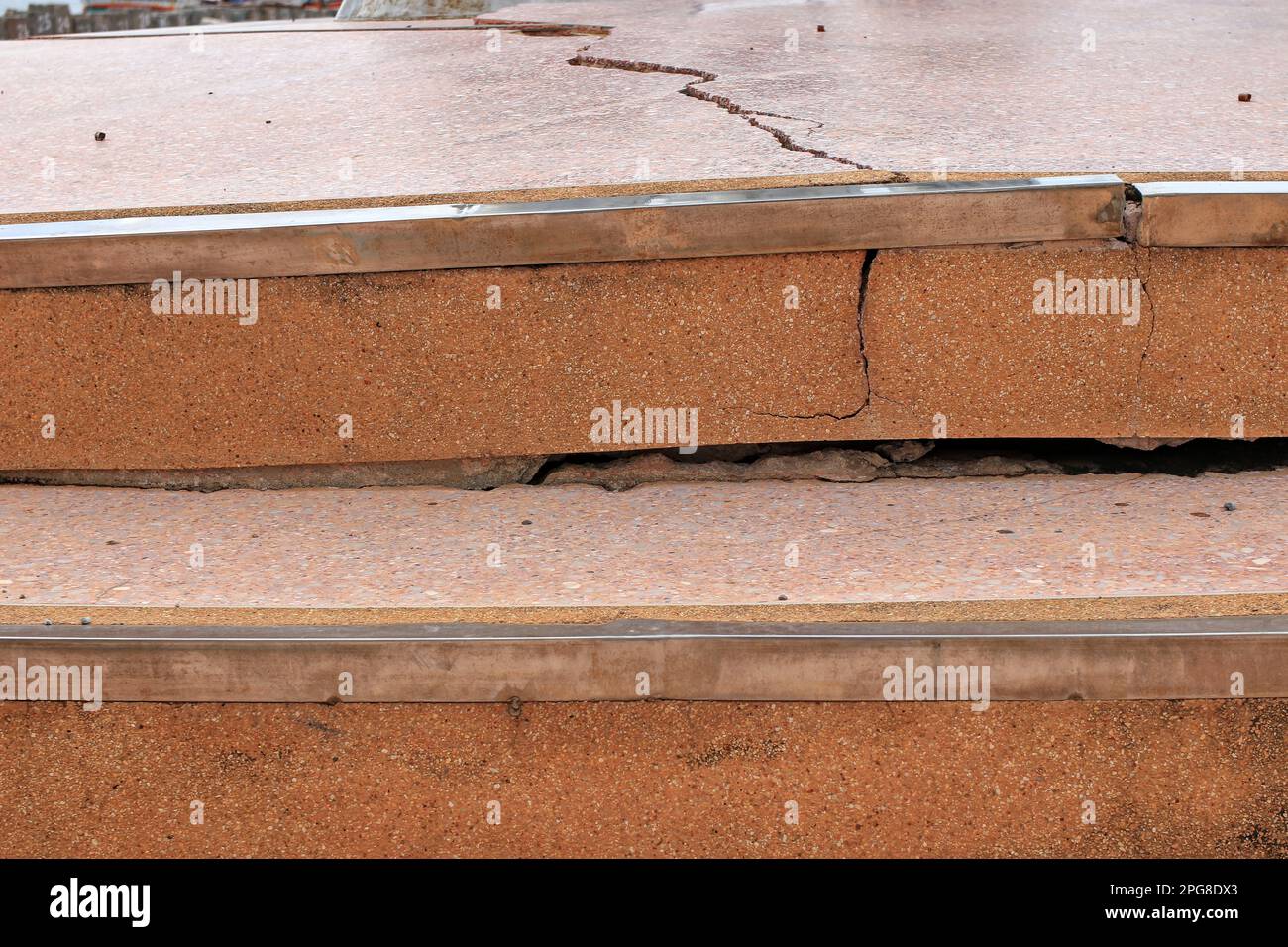 cracked marble stairs Granite steps collapsed. Indicates that the compaction of the floor is not tight enough. Stock Photo