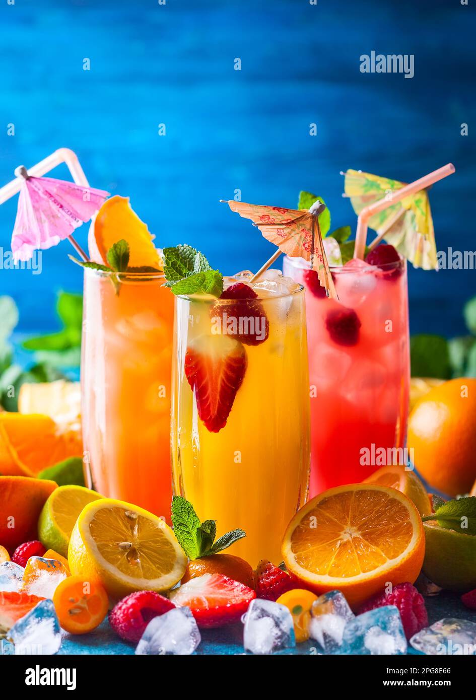 Different types of summer drinks in glasses, cubes of ice and slice of
