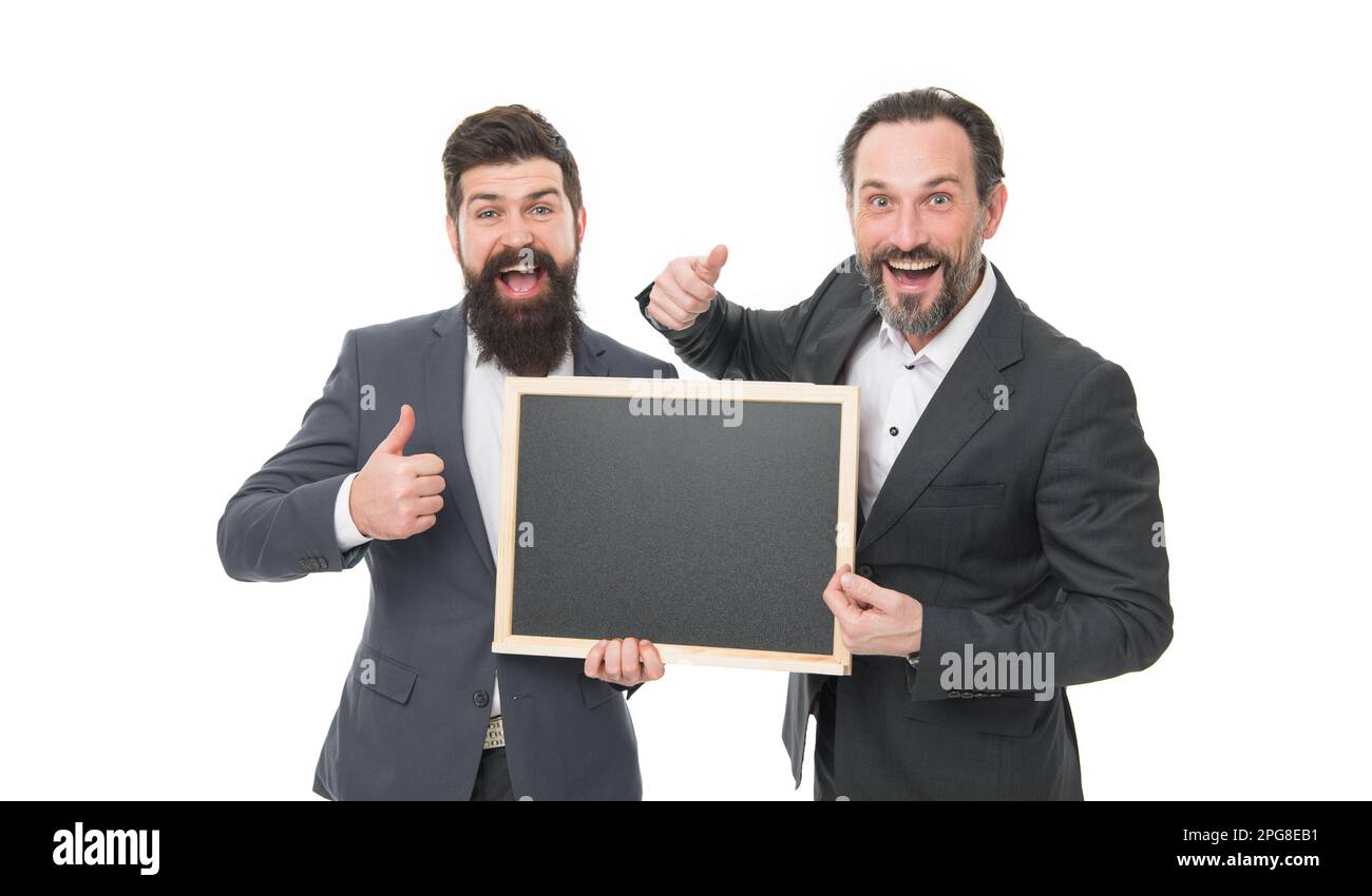 Promoting and approving. Happy marketing managers give thumbs ups holding blackboard. Promoting product. Promoting and advertising. Promotion. Marketi Stock Photo