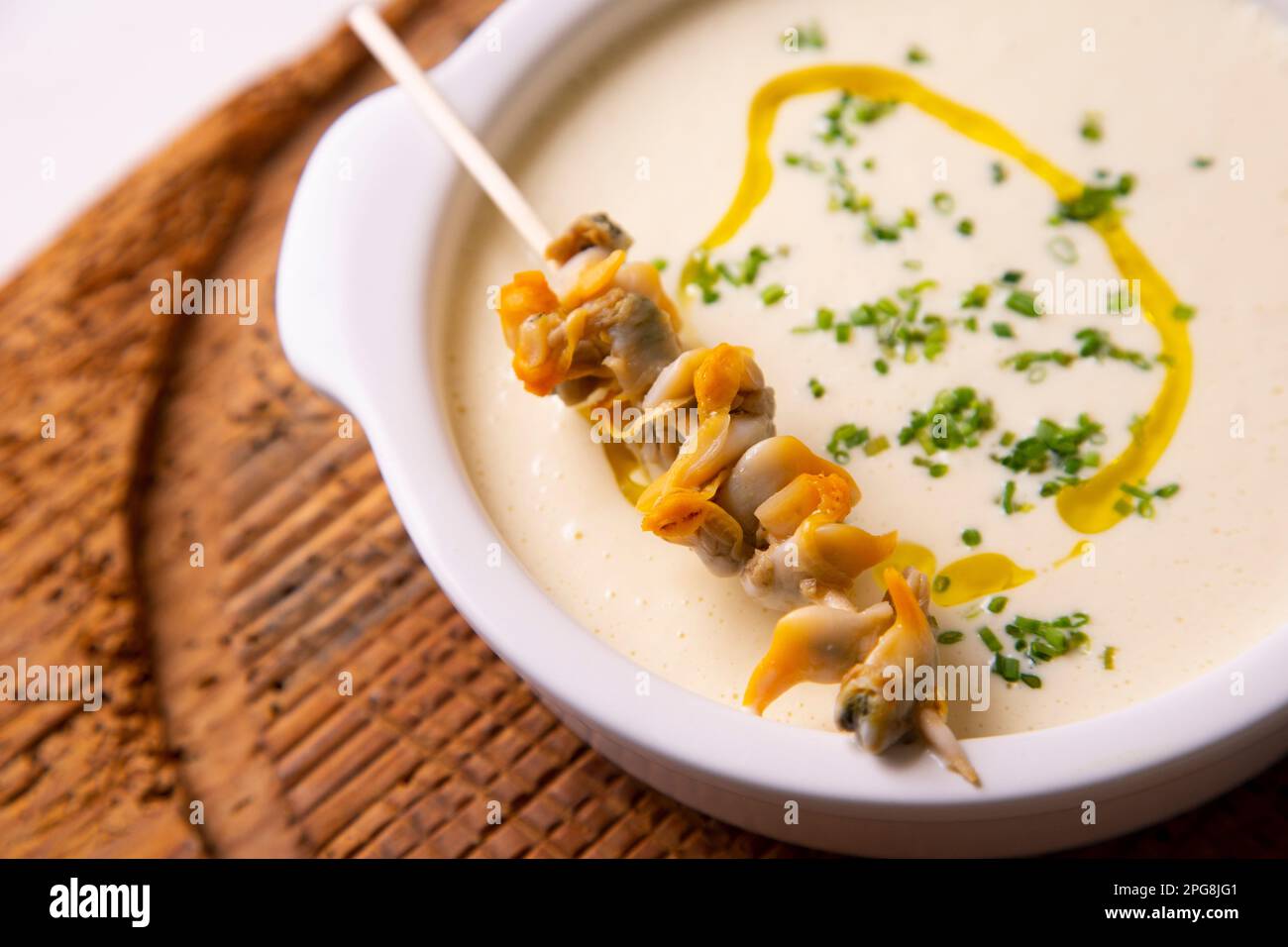 Spanish tapa of cream of cockles with mayonnaise. Stock Photo