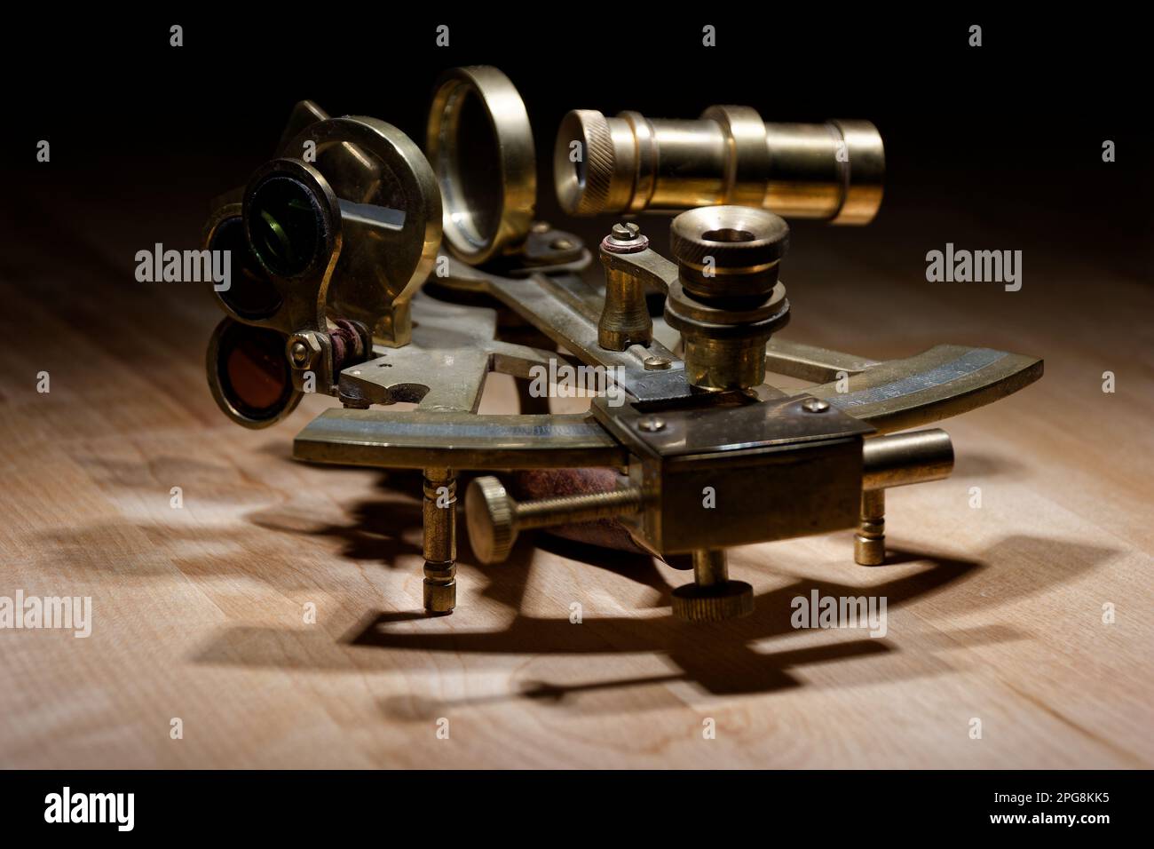 old sextant, spyglass, circle and compass lying on wooden table Stock Photo