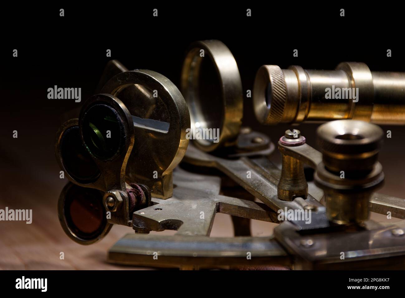 old sextant, spyglass, circle and compass lying on wooden table Stock Photo