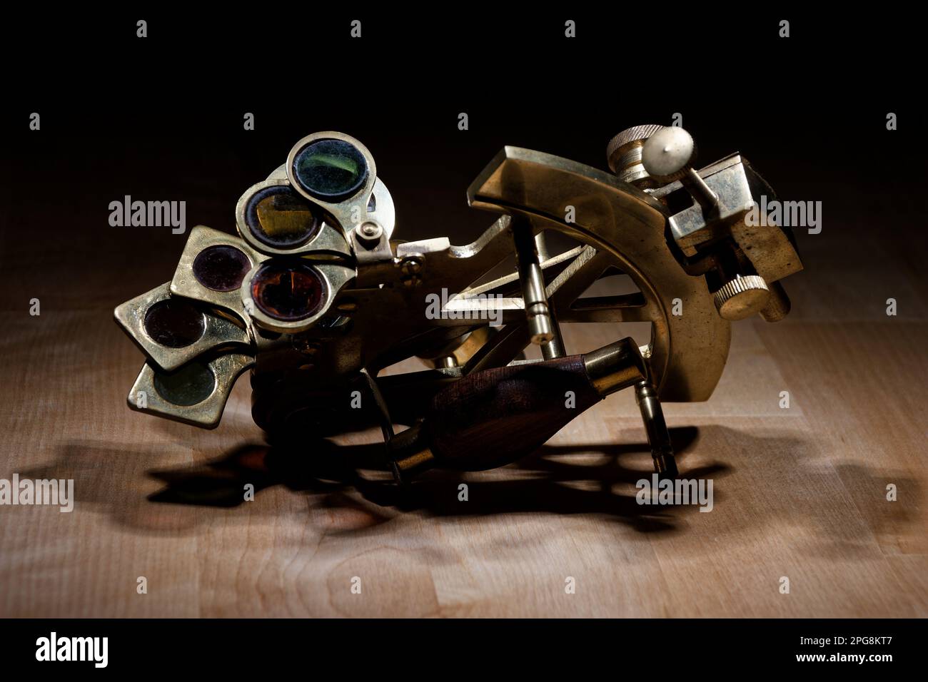 old sextant, spyglass, circle and compass lying on wooden table Stock Photo