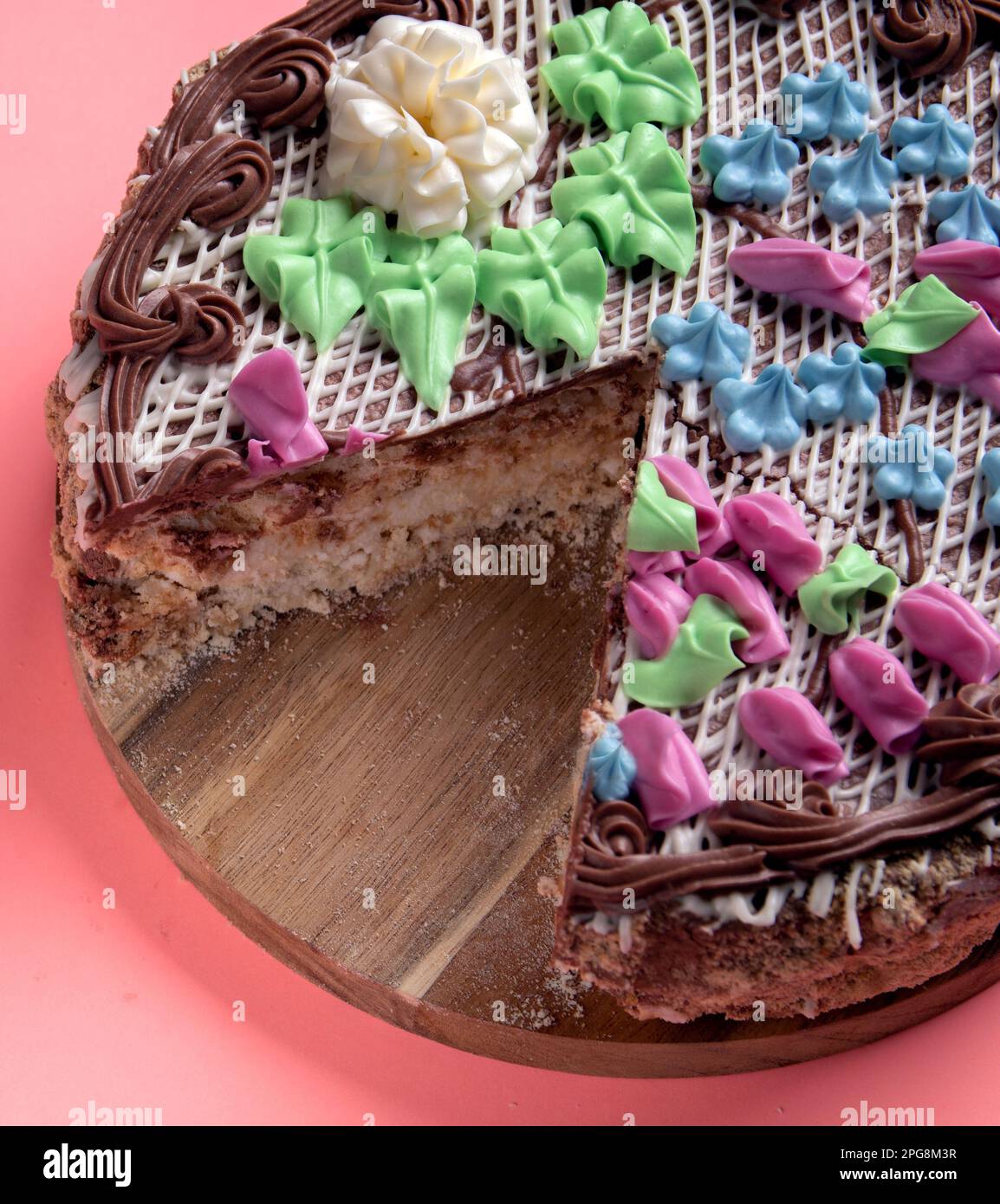 photo cues cake without one piece on a wooden board Stock Photo