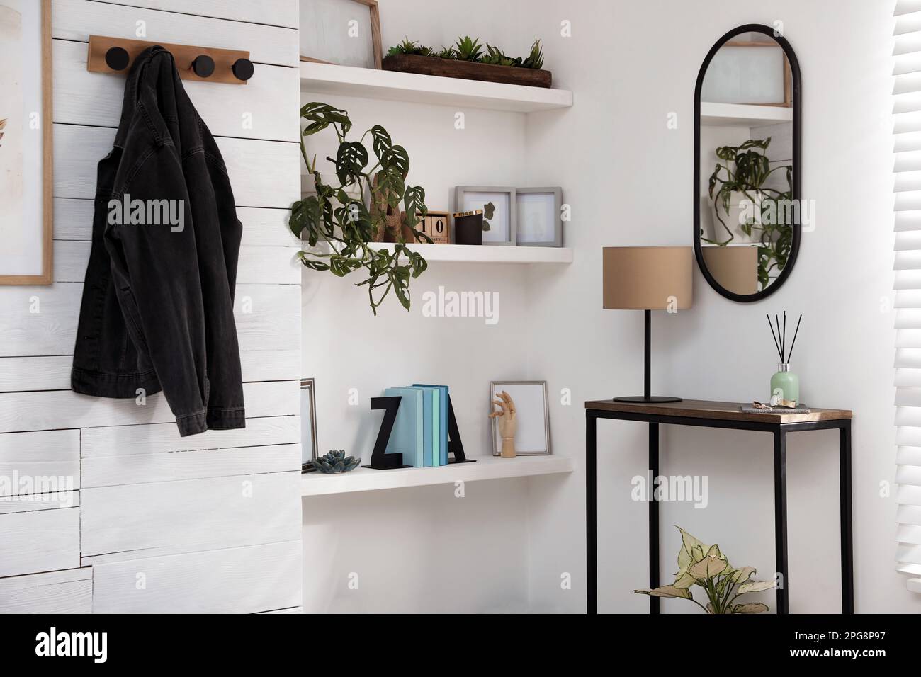 Hallway interior with console table and stylish decor Stock Photo - Alamy