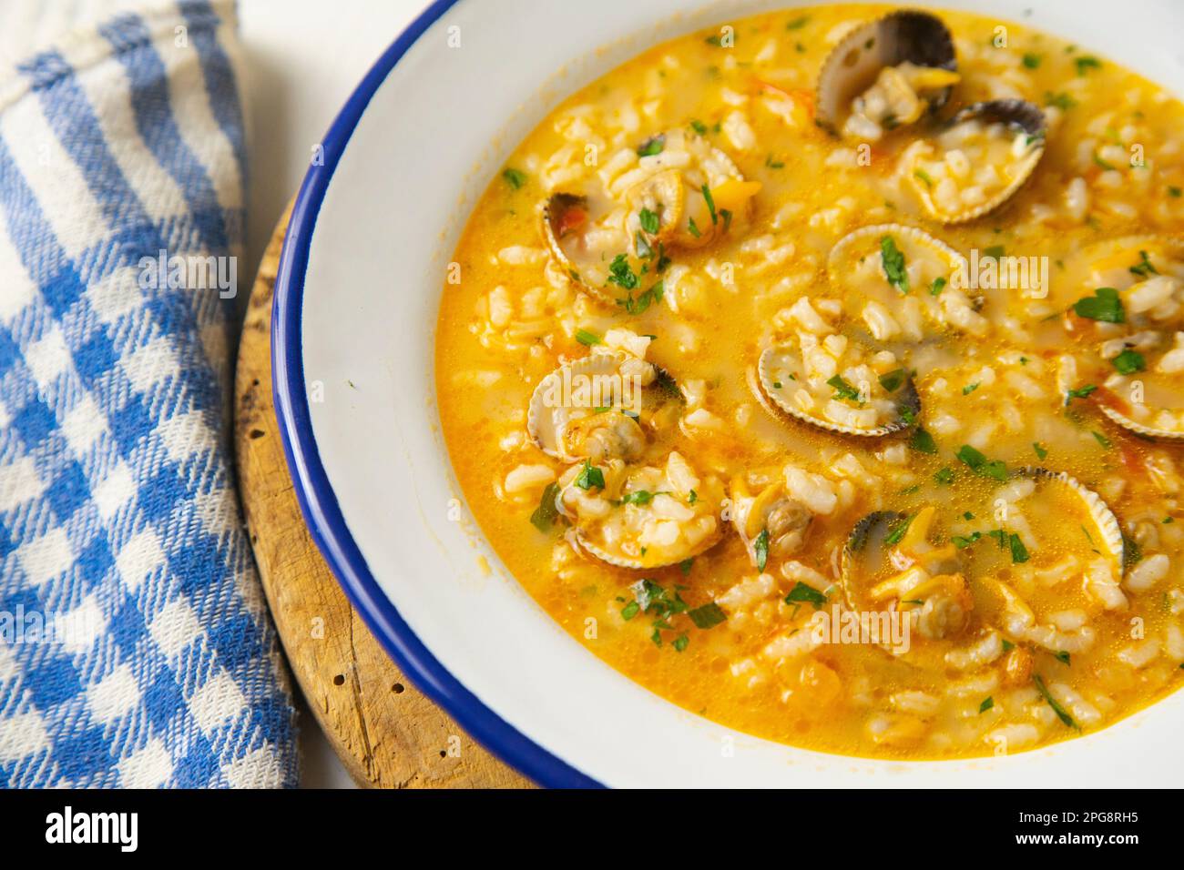 Rice soup with clams. Traditional Spanish recipe Stock Photo Alamy