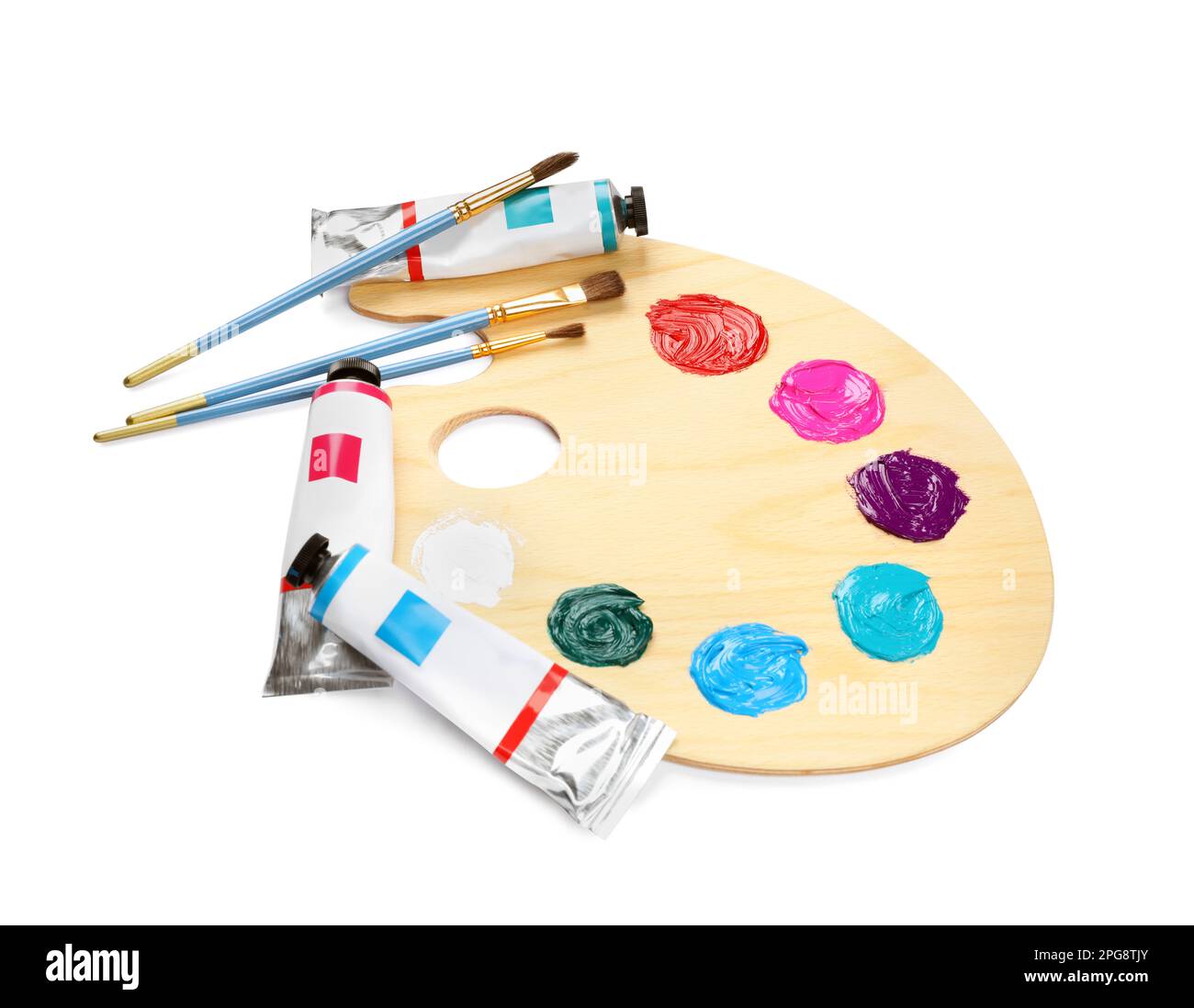 Wooden artist's palette with brushes and paints on white background