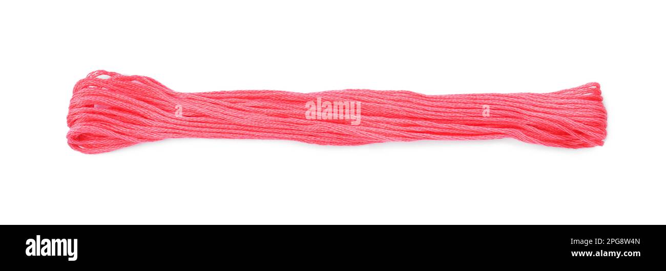Bright pink embroidery thread on white background Stock Photo - Alamy
