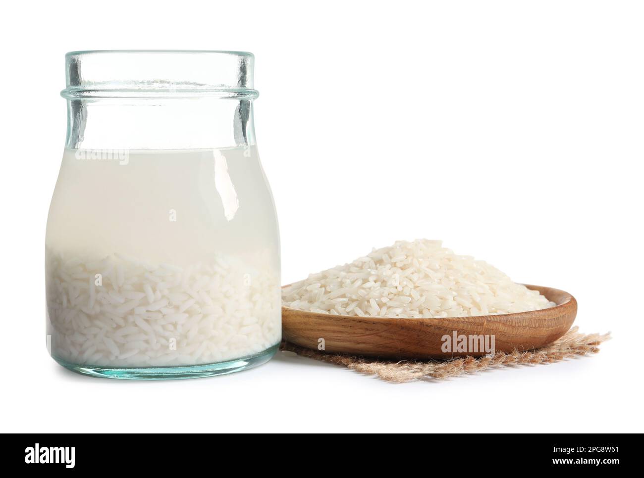 Rice soaked in water on white background Stock Photo Alamy