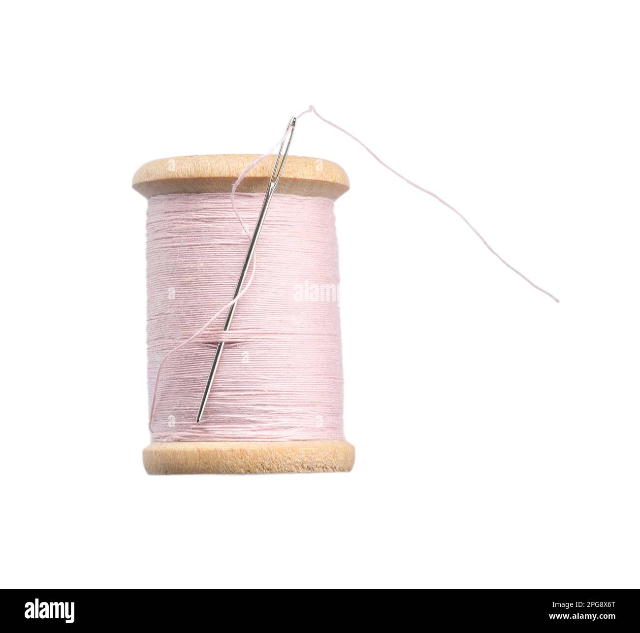 Pink sewing thread with needle isolated on white Stock Photo Alamy