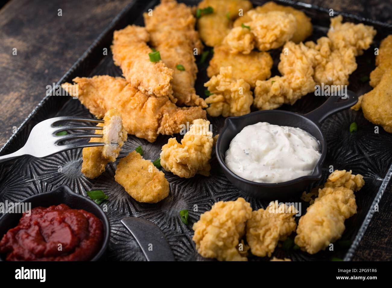 Chicken nuggets, strips and bites Stock Photo Alamy