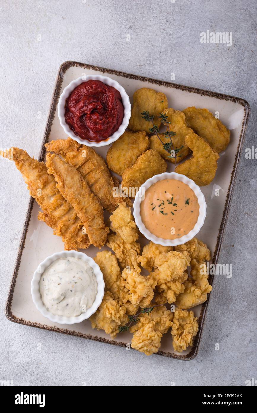 Chicken nuggets, strips and bites Stock Photo Alamy
