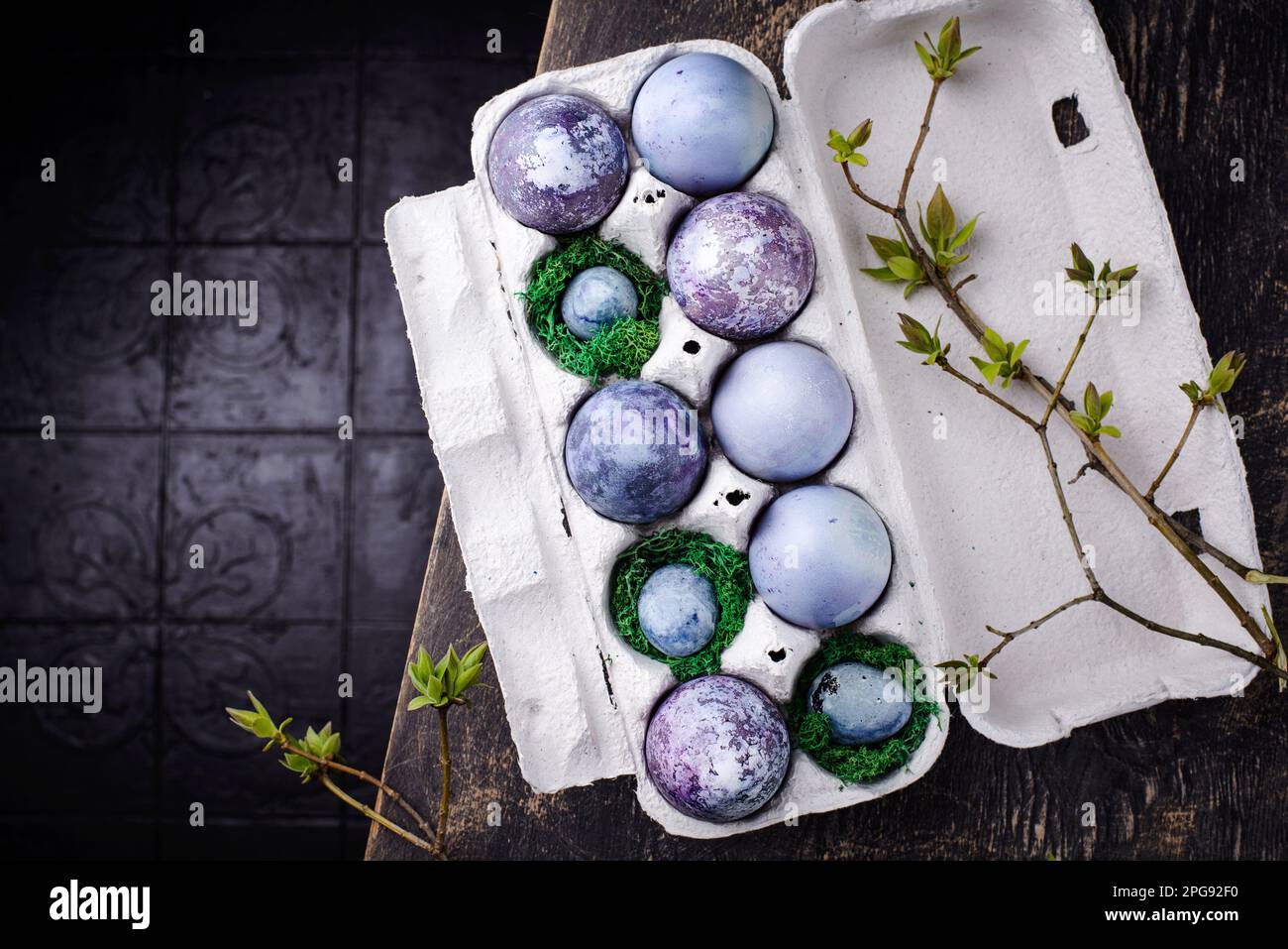 Festive Easter eggs in purple and blue color Stock Photo