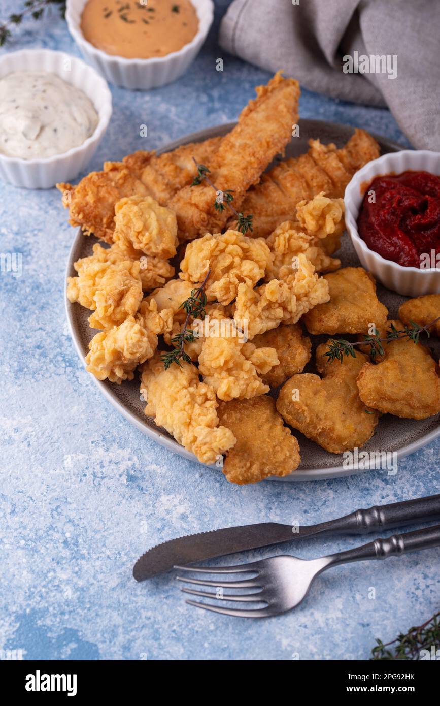 Chicken nuggets, strips and bites Stock Photo Alamy