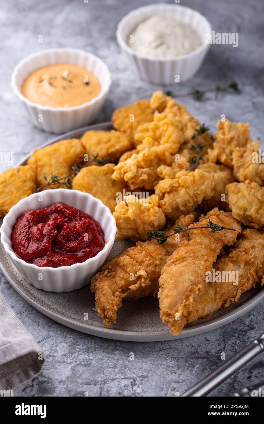 Chicken nuggets, strips and bites Stock Photo Alamy