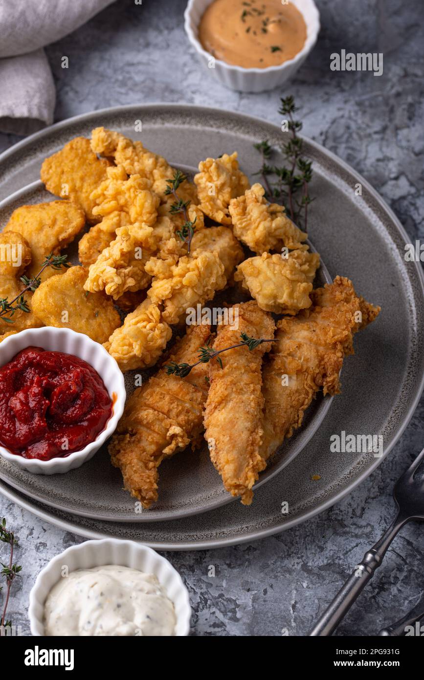 Chicken nuggets, strips and bites Stock Photo Alamy