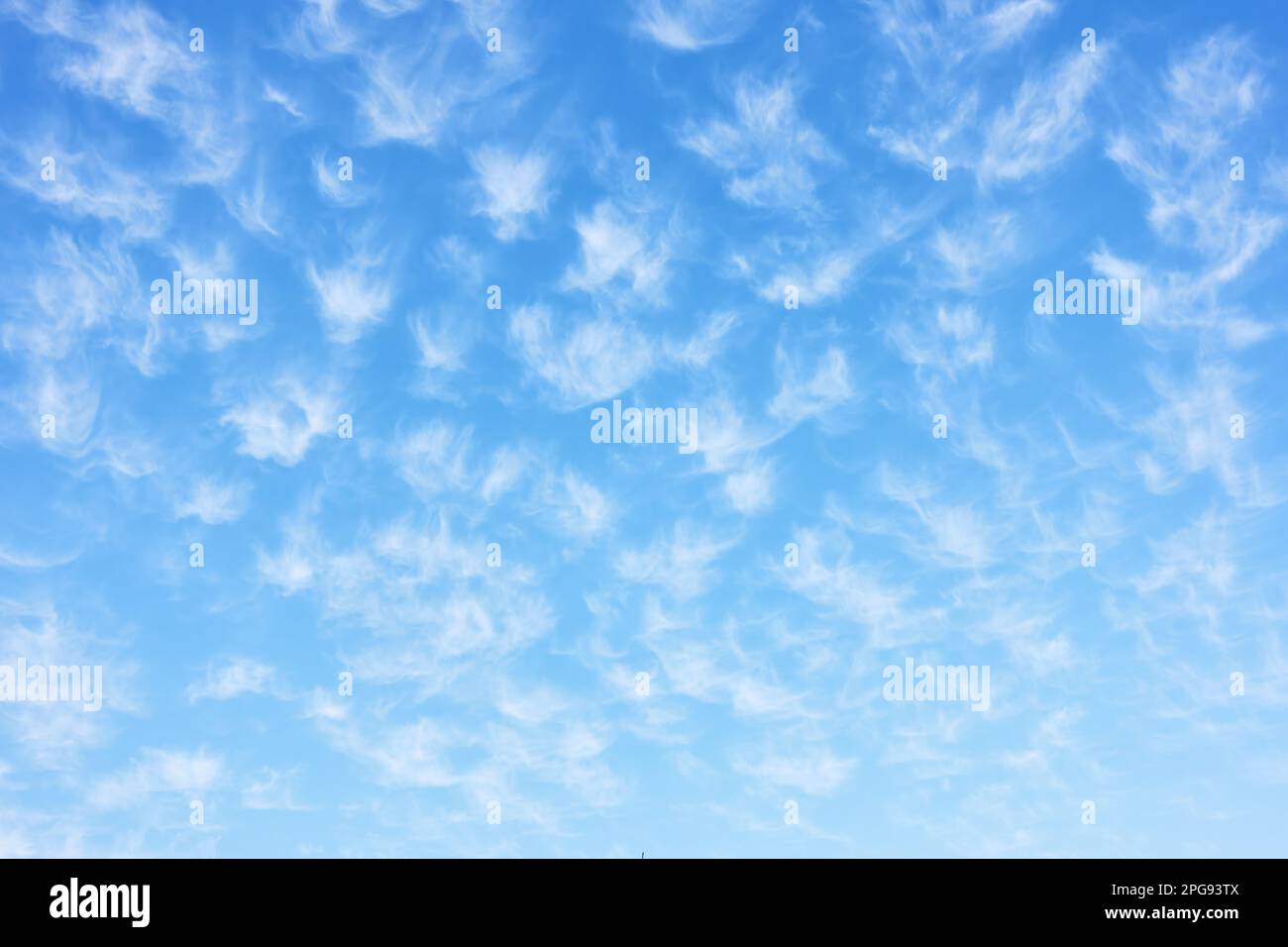 Beautiful spring sky with many small light clouds, may be used as background Stock Photo