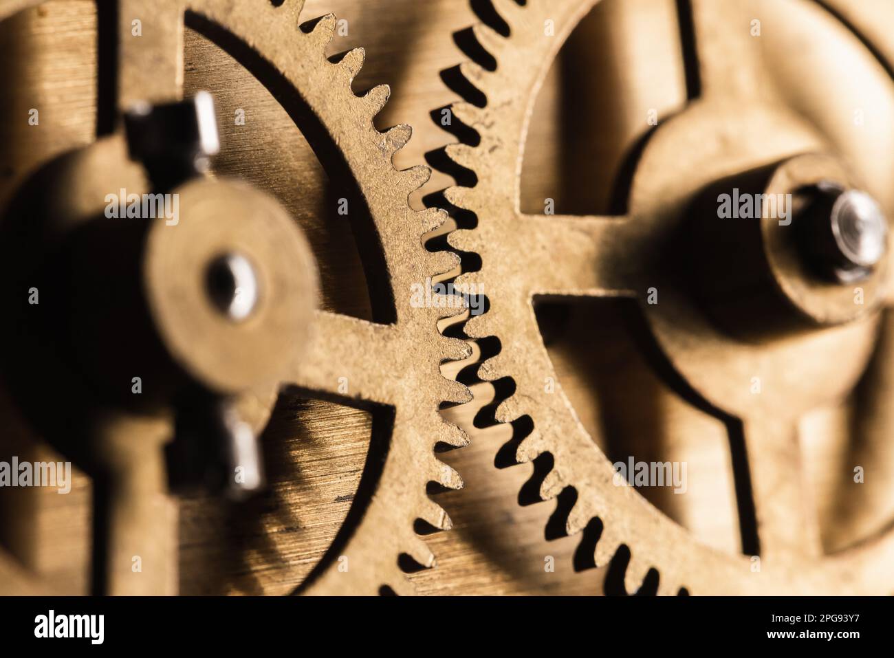 Cogwheels of a vintage clock, close up photo with selective soft focus Stock Photo