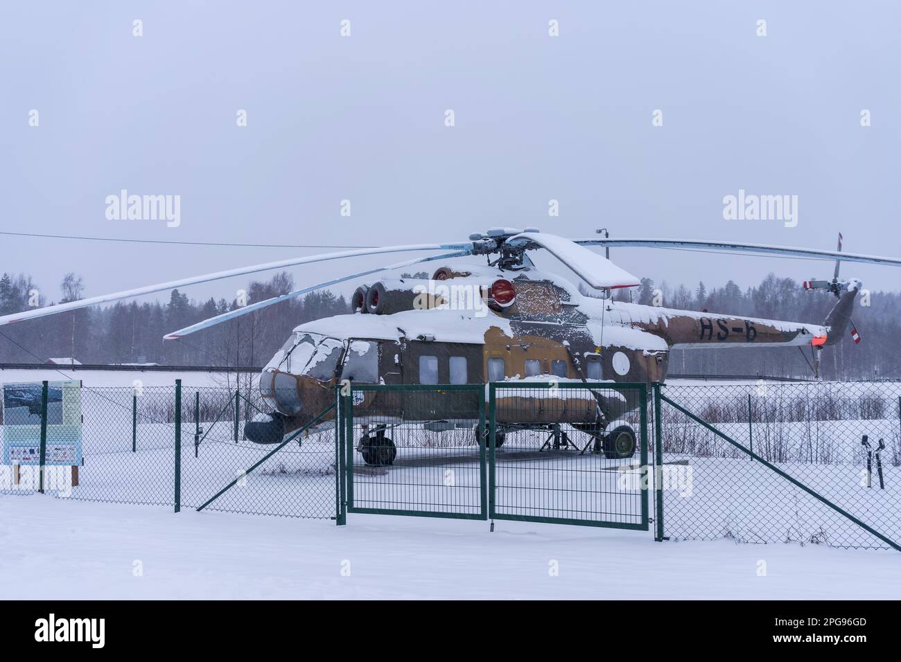 Mil Mi-8P Helicopter covered in snow outside shopping center Tuulonen in Hameenlinna, Finland. February 23, 2023. Stock Photo