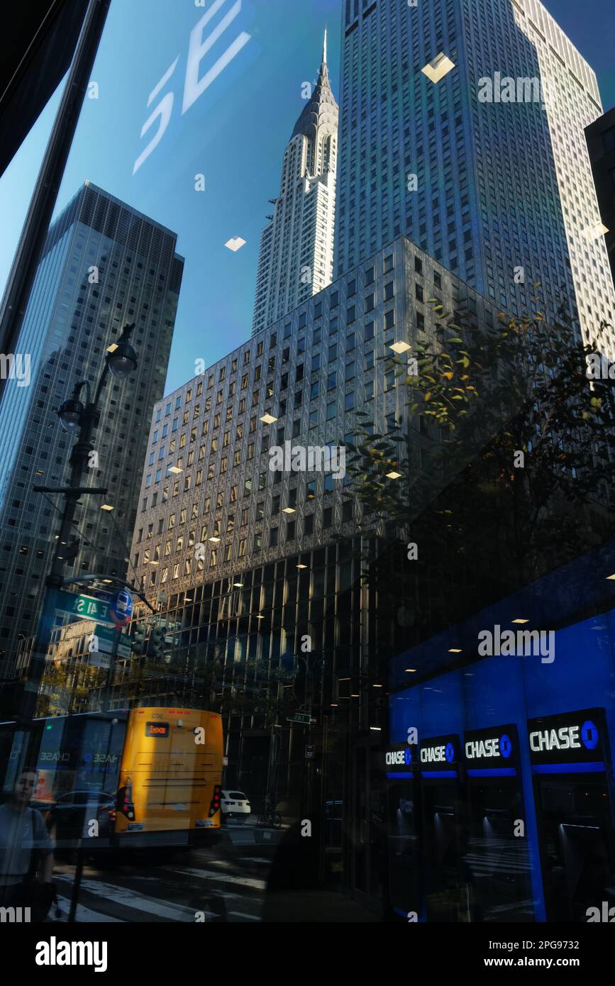 Chrysler Building and skyscrapers reflected in a bank window, New York City Stock Photo