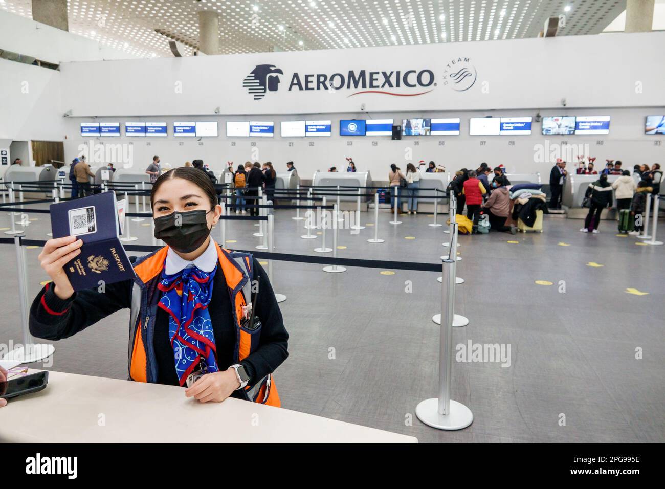 Mexico City,Aeropuerto Internacional Benito Juarez International Airport,terminal Aeromexico agent interviewer checking US passport,ticketing check-in Stock Photo