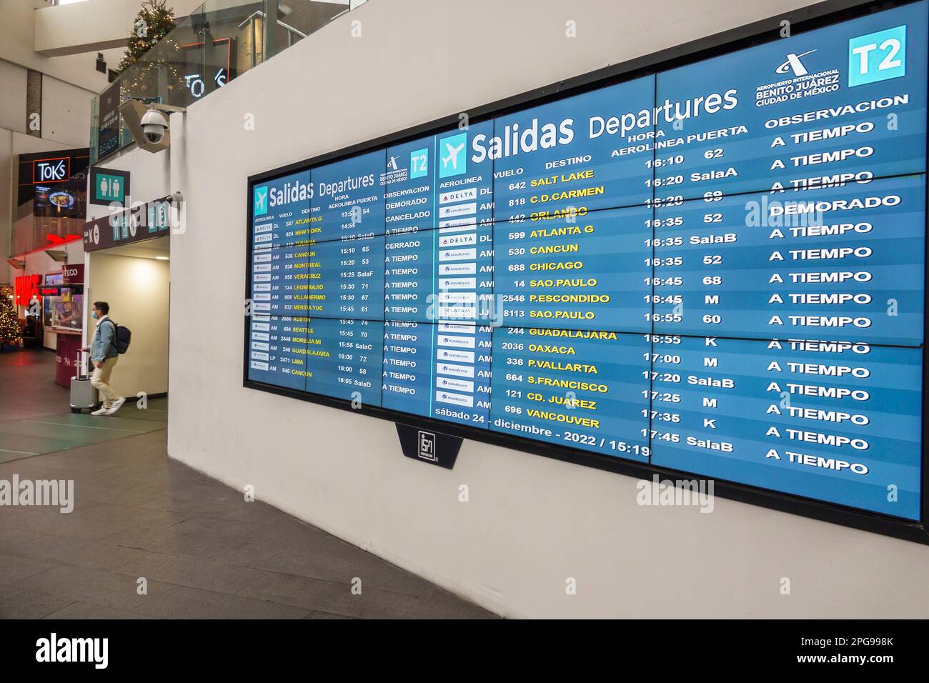Mexico City,Aeropuerto Internacional Benito Juarez International Airport,terminal concourse,departures schedule,man men male,adult adults,resident res Stock Photo