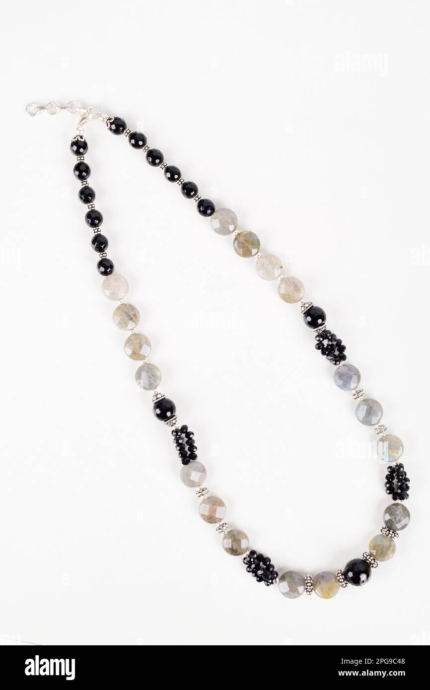 Top view of black bead necklace isolated on white background, semi